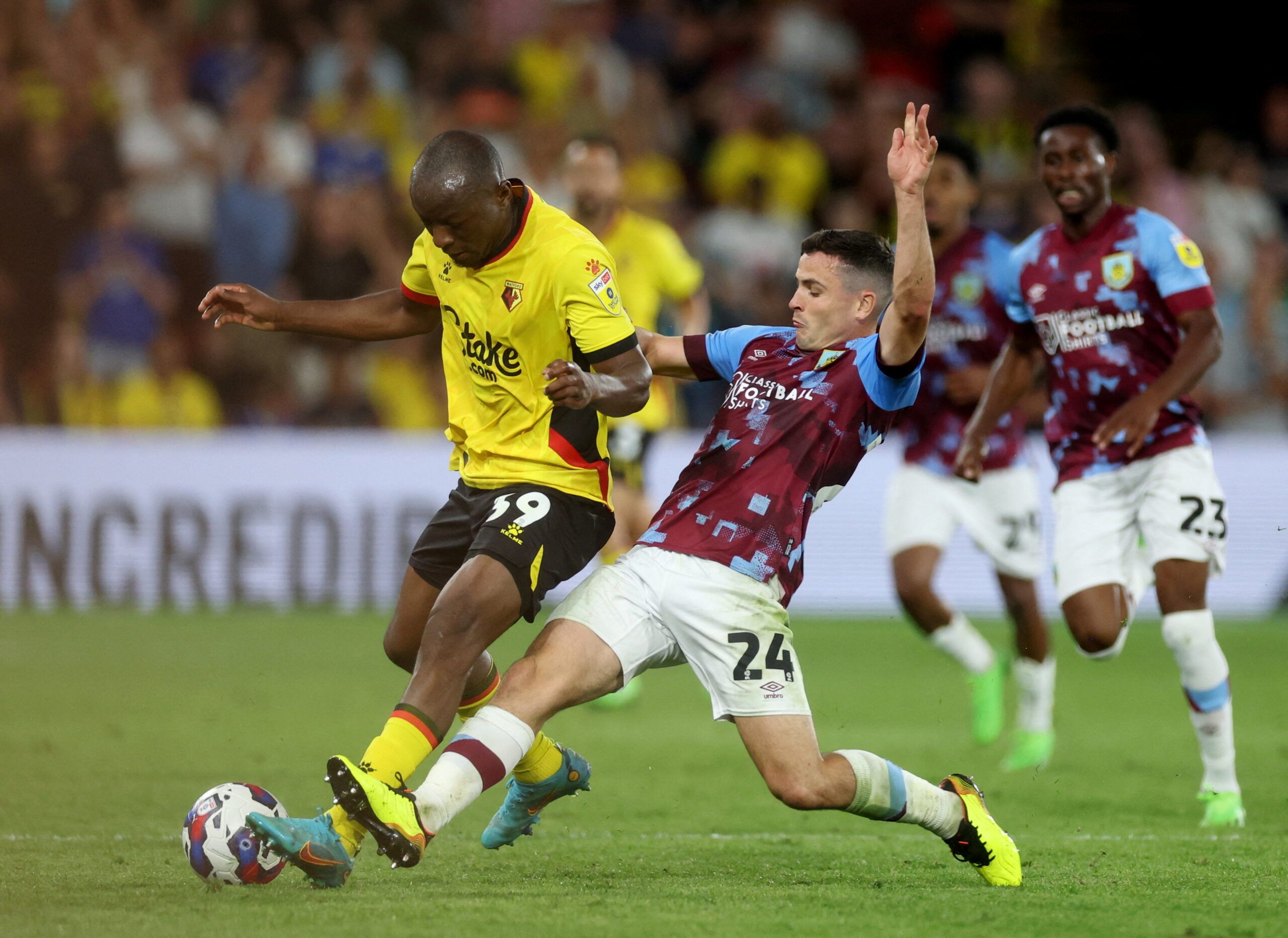 Soccer Football - Championship - Watford v Burnley - Vicarage Road, Watford, Britain - August 12, 2022 Watford's Edo Kayembe in action with Burnley's Josh Cullen Action Images/Paul Childs  EDITORIAL USE ONLY. No use with unauthorized audio, video, data, fixture lists, club/league logos or 
