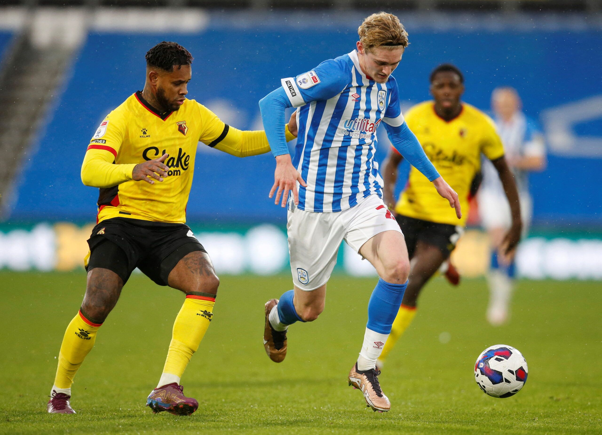 Soccer Football - Championship - Huddersfield Town v Watford - John Smith's Stadium, Huddersfield, Britain - December 17, 2022 Watford's Leandro Bacuna in action with Huddersfield Town's Jack Rudoni  Action Images/Ed Sykes  EDITORIAL USE ONLY. No use with unauthorized audio, video, data, fixture lists, club/league logos or 