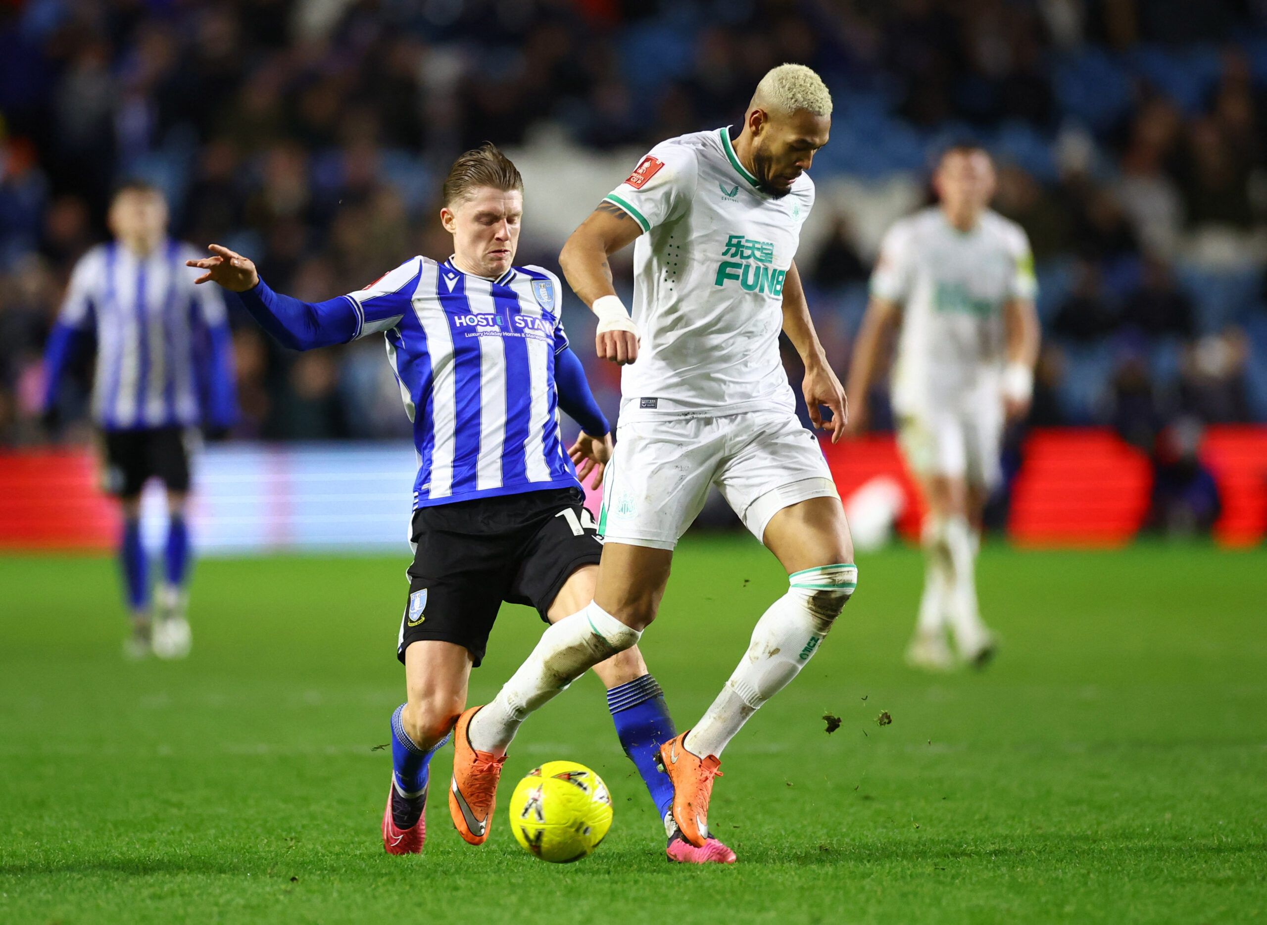 Soccer Football - FA Cup Third Round - Sheffield Wednesday v Newcastle United - Hillsborough Stadium, Sheffield, Britain - January 7, 2023 Newcastle United's Joelinton in action with Sheffield Wednesday's George Byers REUTERS/Carl Recine