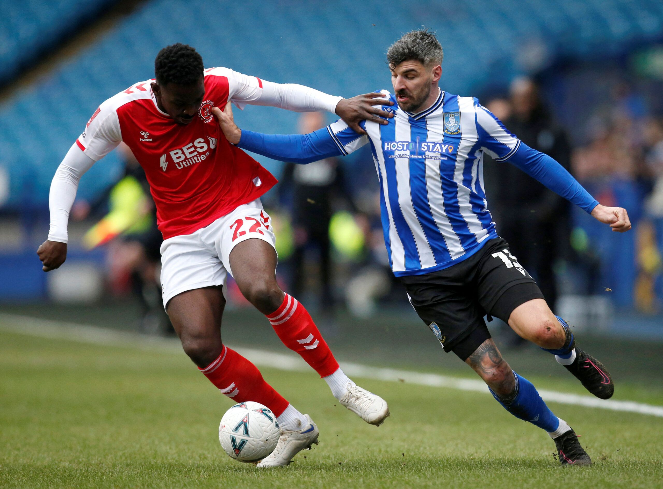 Soccer Football - FA Cup - Fourth Round - Sheffield Wednesday v Fleetwood Town - Hillsborough Stadium, Sheffield, Britain - January 28, 2023 Fleetwood Town's Aristote Nsiala and Sheffield Wednesday's Callum Paterson in action  Action Images/Ed Sykes