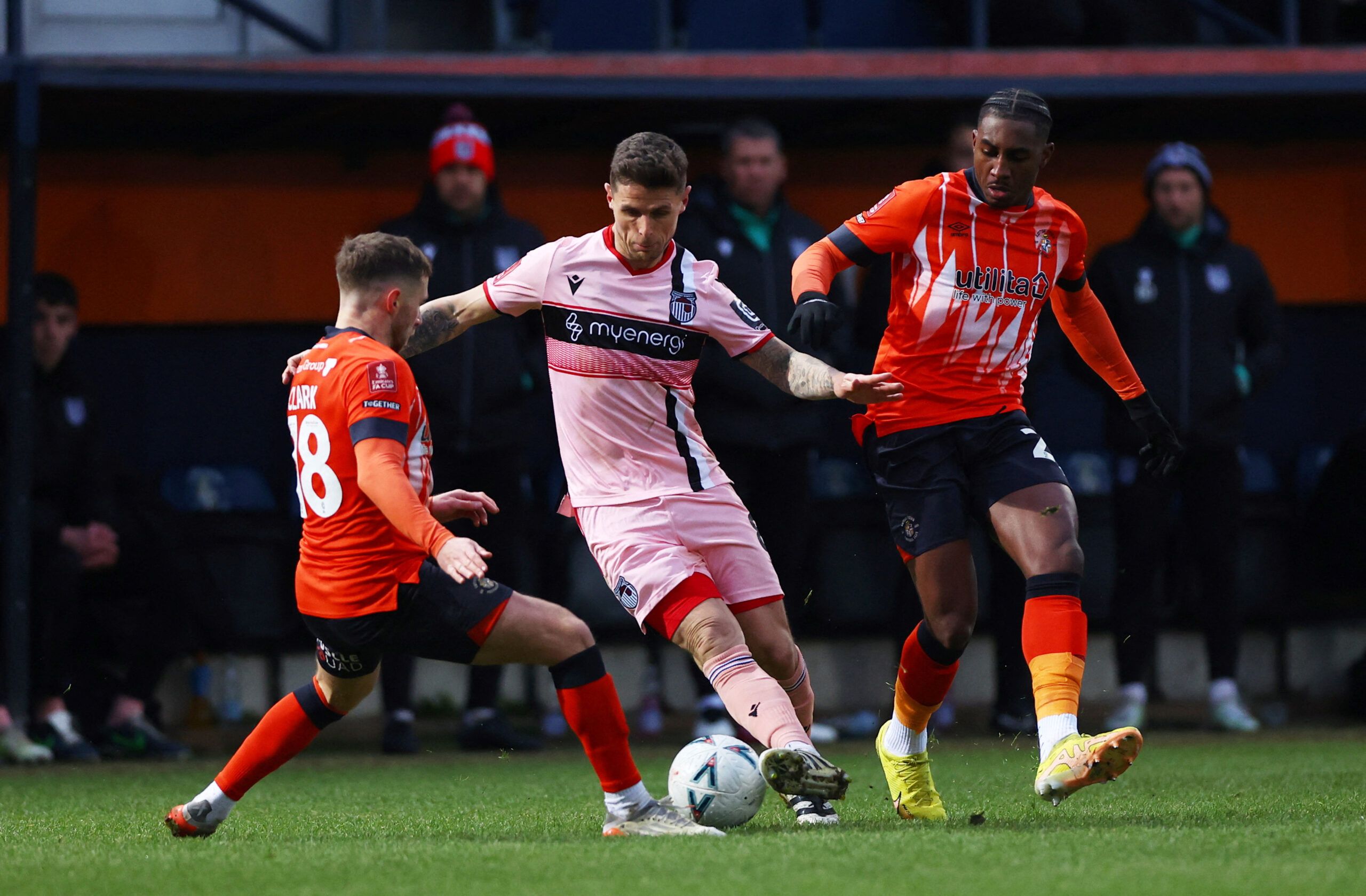 Soccer Football - FA Cup - Fourth Round - Luton Town v Grimsby Town - Kenilworth Road, Luton, Britain - January 28, 2023 Luton Town's Jordan Clark in action with Grimsby Town's Gavan Holohan  Action Images/Matthew Childs