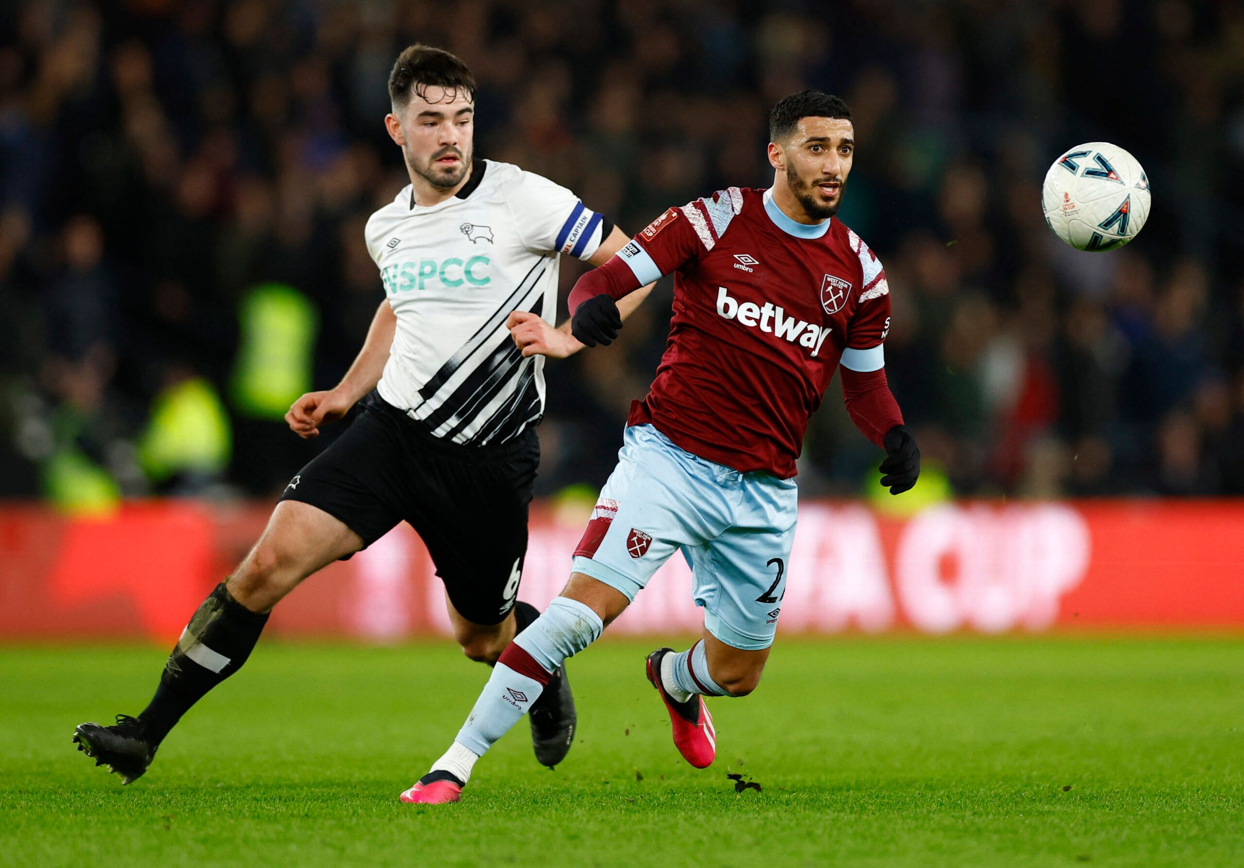Soccer Football - FA Cup - Fourth Round - Derby County v West Ham United - Pride Park, Derby, Britain - January 30, 2023 Derby County's Eiran Cashin in action with West Ham United's Nayef Aguerd Action Images via Reuters/Peter Cziborra