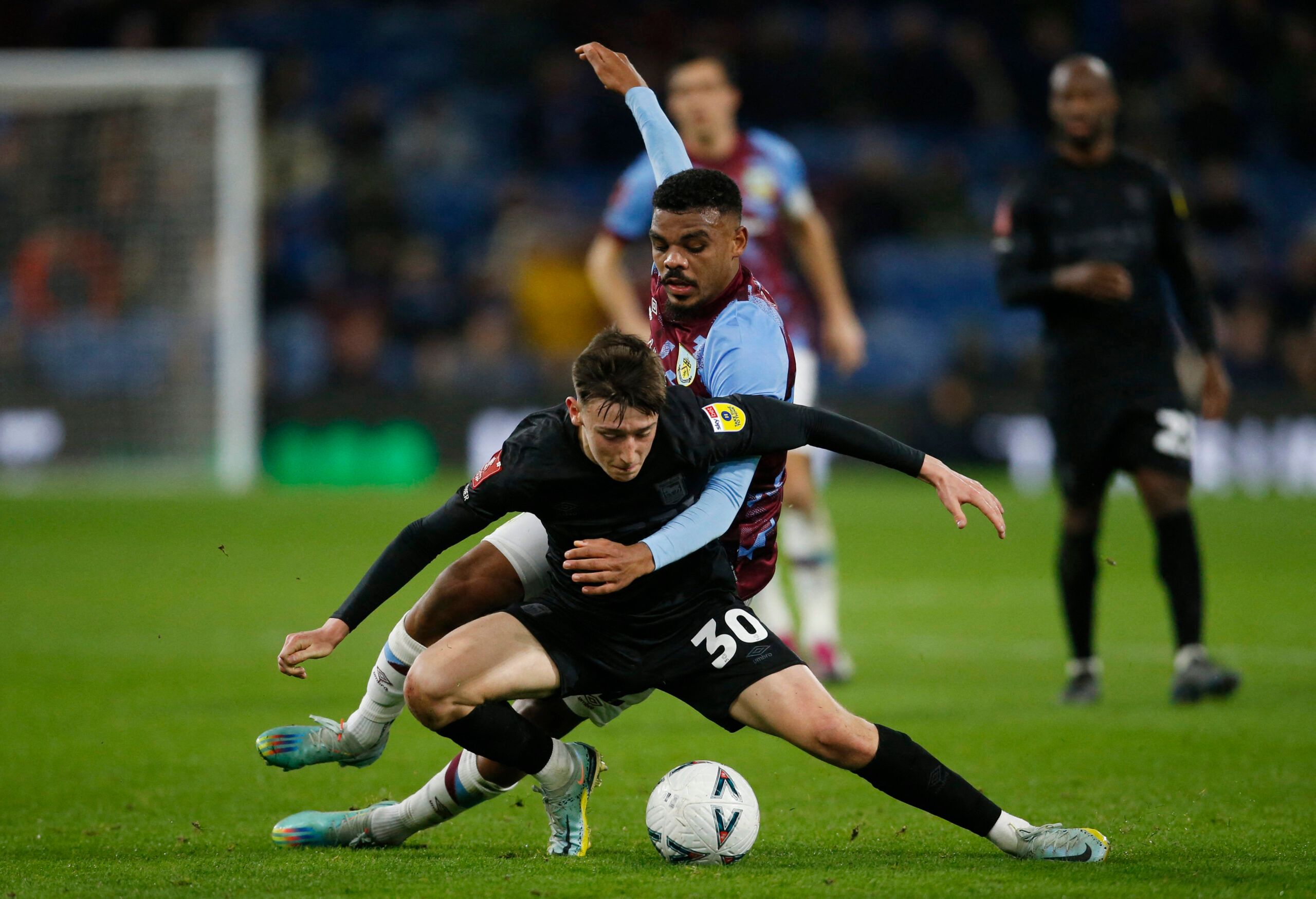 Soccer Football - FA Cup Fourth Round Replay - Burnley v Ipswich Town - Turf Moor, Burnley, Britain - February 7, 2023 Ipswich Town's Cameron Humphreys in action with Burnley's Lyle Foster Action Images/Ed Sykes