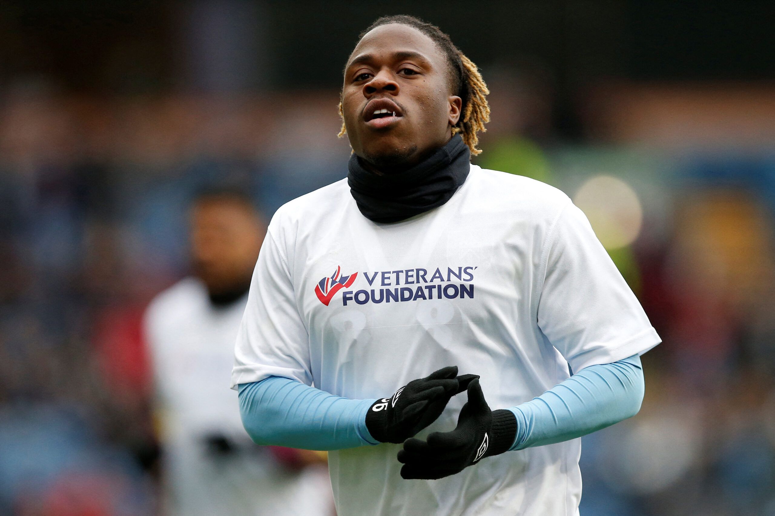 Soccer Football - Championship - Burnley v Preston North End - Turf Moor, Burnley, Britain - February 11, 2023 Burnley's Michael Obafemi wearing a shirt supporting the Veterans foundation during the warm up before the match Action Images/Craig Brough  EDITORIAL USE ONLY. No use with unauthorized audio, video, data, fixture lists, club/league logos or 