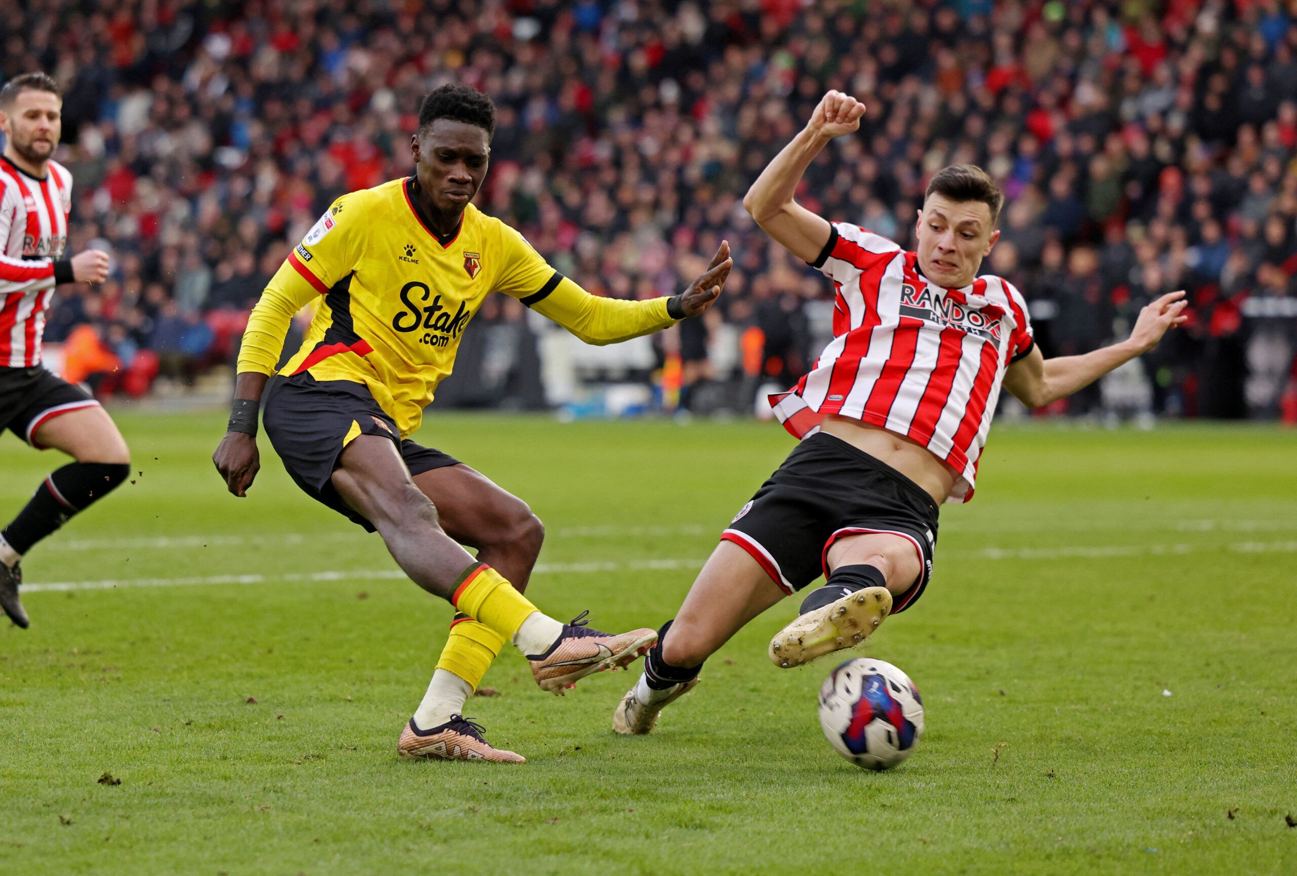 Soccer Football - Championship - Sheffield United v Watford - Bramall Lane, Sheffield, Britain - February 25, 2023 Watford's Ismaila Sarr in action with Sheffield United's Anel Ahmedhodzic  Action Images/John Clifton  EDITORIAL USE ONLY. No use with unauthorized audio, video, data, fixture lists, club/league logos or 
