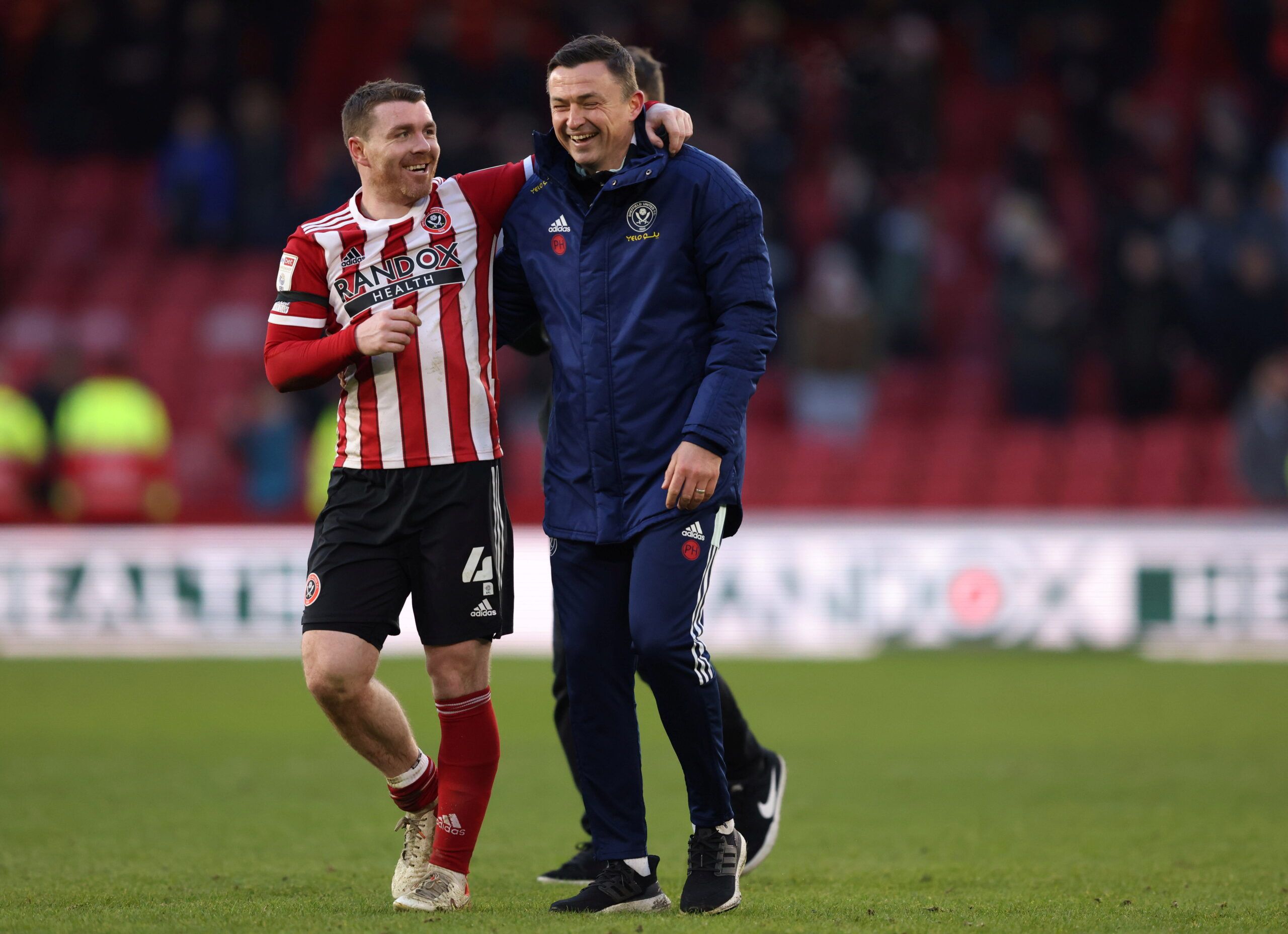 Soccer Football - Championship - Sheffield United v Swansea City - Bramall Lane, Sheffield, Britain - February 19, 2022 Sheffield United manager Paul Heckingbottom and John Fleck celebrate after the match  Action Images/John Clifton??EDITORIAL USE ONLY. No use with unauthorized audio, video, data, fixture lists, club/league logos or 