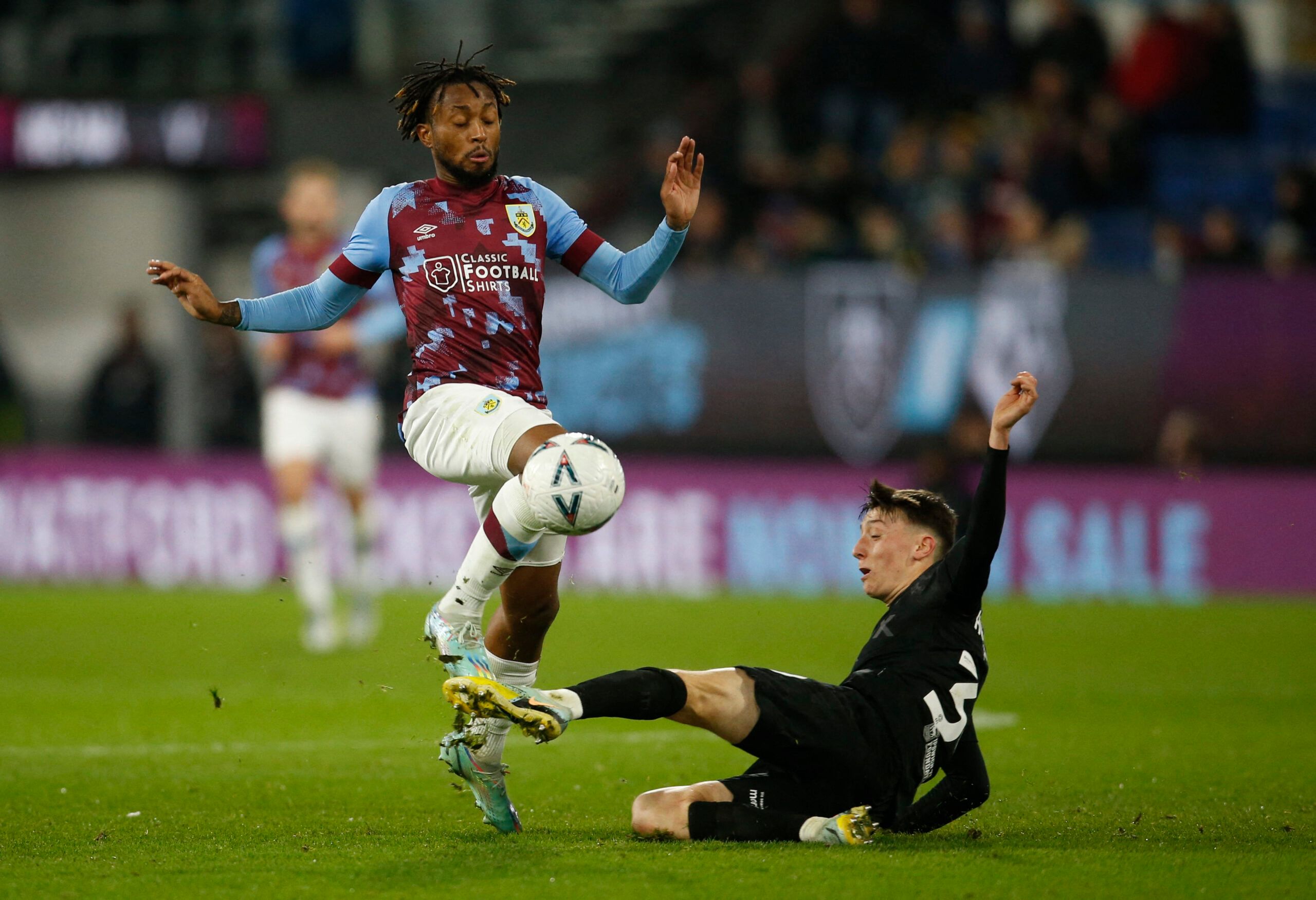 Soccer Football - FA Cup Fourth Round Replay - Burnley v Ipswich Town - Turf Moor, Burnley, Britain - February 7, 2023 Burnley's Samuel Bastien in action with Ipswich Town's Cameron Humphreys Action Images/Ed Sykes