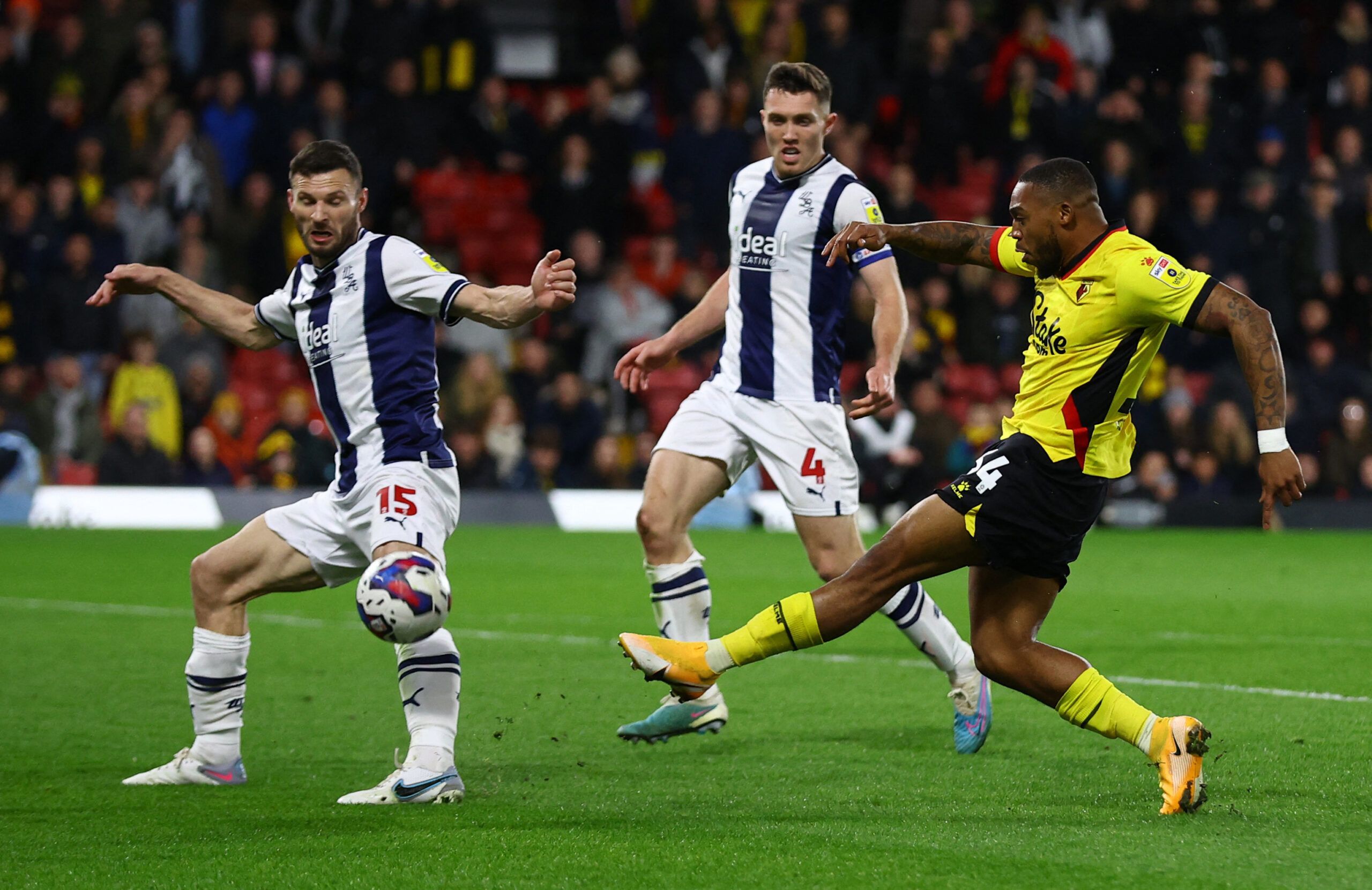 Soccer Football - Championship - Watford v West Bromwich Albion - Vicarage Road, Watford, Britain - February 20, 2023 Watford's Hassane Kamara shoots past West Bromwich Albion's Erik Pieters Action Images/Matthew Childs EDITORIAL USE ONLY. No use with unauthorized audio, video, data, fixture lists, club/league logos or 'live' services. Online in-match use limited to 75 images, no video emulation. No use in betting, games or single club /league/player publications.  Please contact your account re