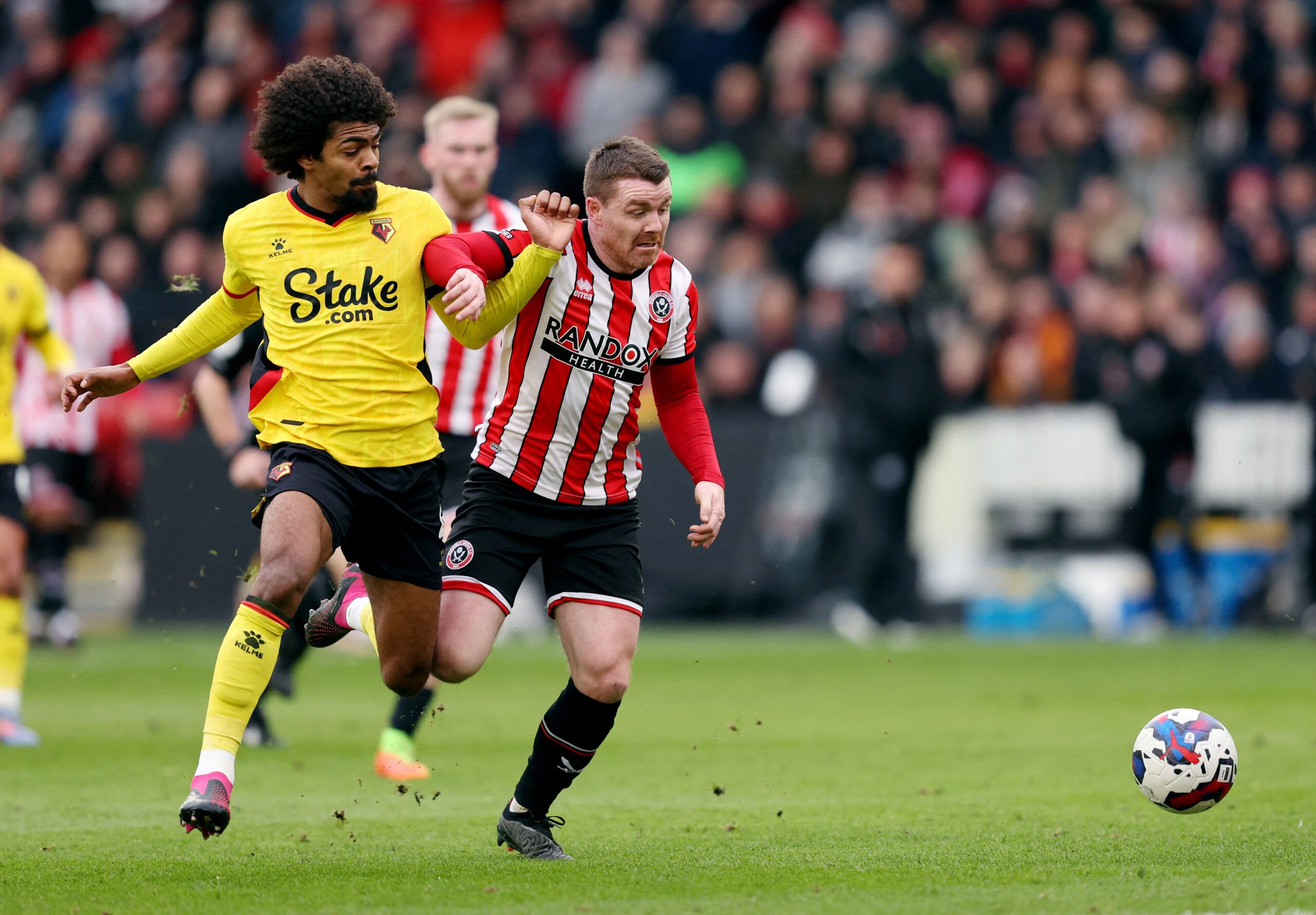 Soccer Football - Championship - Sheffield United v Watford - Bramall Lane, Sheffield, Britain - February 25, 2023 Sheffield United's John Fleck in action with Watford's Hamza Choudhury  Action Images/John Clifton  EDITORIAL USE ONLY. No use with unauthorized audio, video, data, fixture lists, club/league logos or 