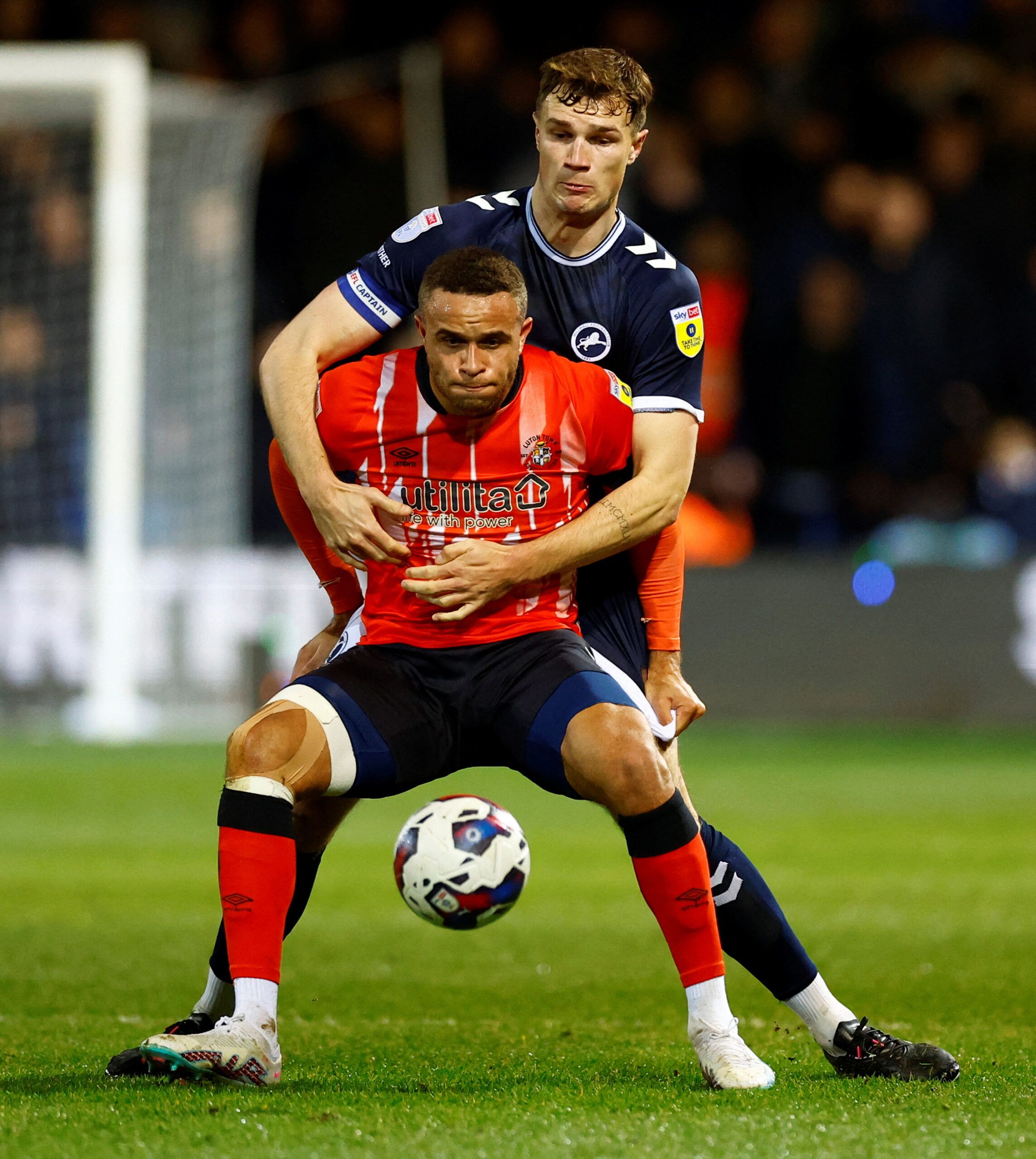 Soccer Football - Championship - Luton Town v Millwall - Kenilworth Road, Luton, Britain - February 28, 2023 Luton Town’s Carlton Morris in action with Millwall’s Jake Cooper Action Images/Peter Cziborra