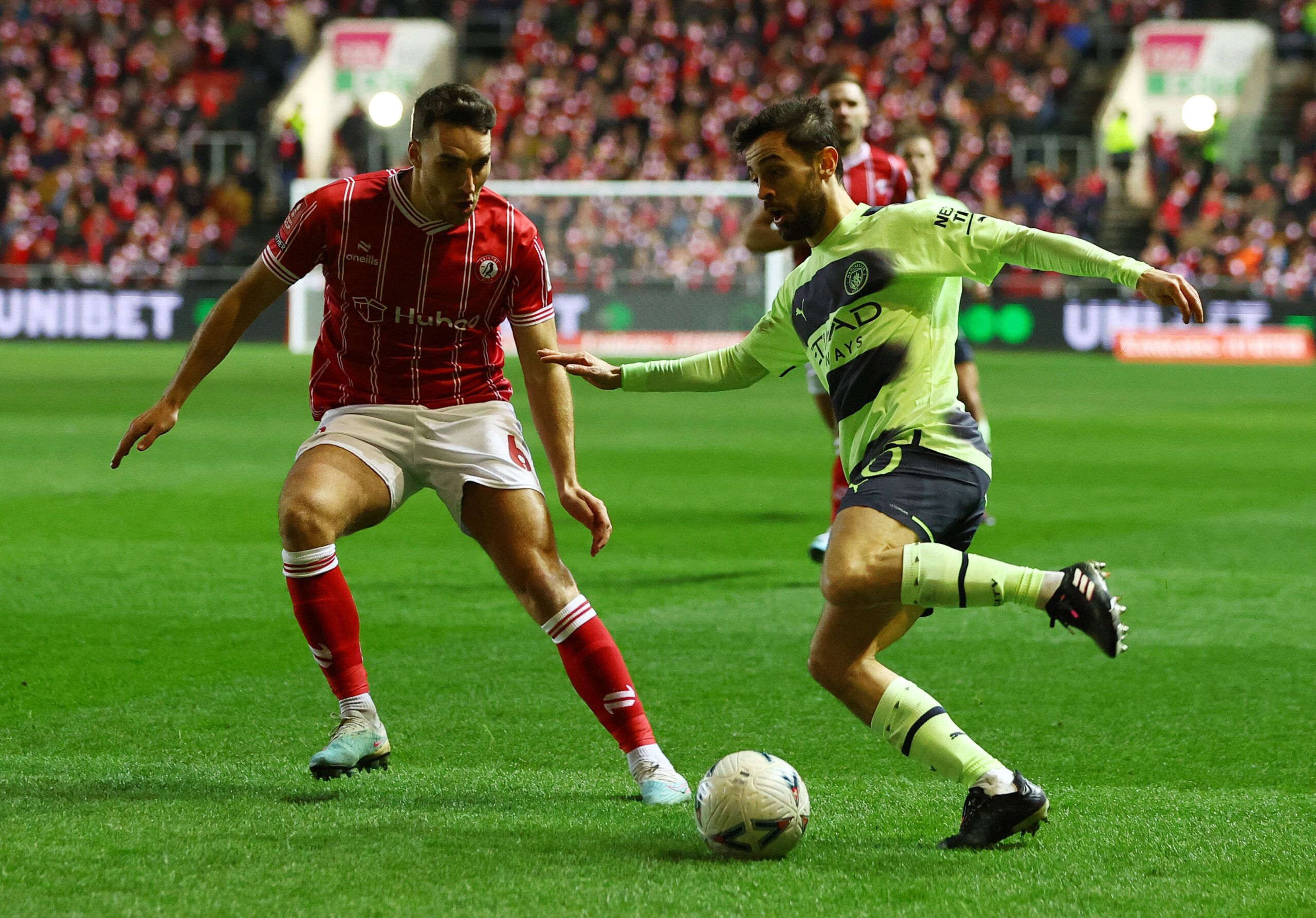 Soccer Football - FA Cup - Fifth Round - Bristol City v Manchester City - Ashton Gate Stadium, Bristol, Britain - February 28, 2023 Manchester City's Bernardo Silva in action with Bristol City's Matty James Action Images via Reuters/Paul Childs