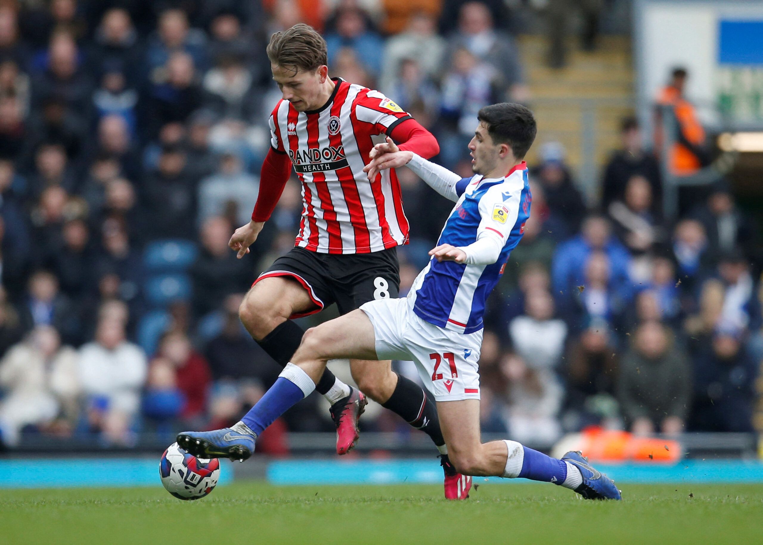 Soccer Football - Championship - Blackburn Rovers v Sheffield United - Ewood Park, Blackburn, Britain - March 4, 2023 Sheffield United's Sander Berge and Blackburn Rovers' John Buckley in action  Action Images/Ed Sykes  EDITORIAL USE ONLY. No use with unauthorized audio, video, data, fixture lists, club/league logos or 