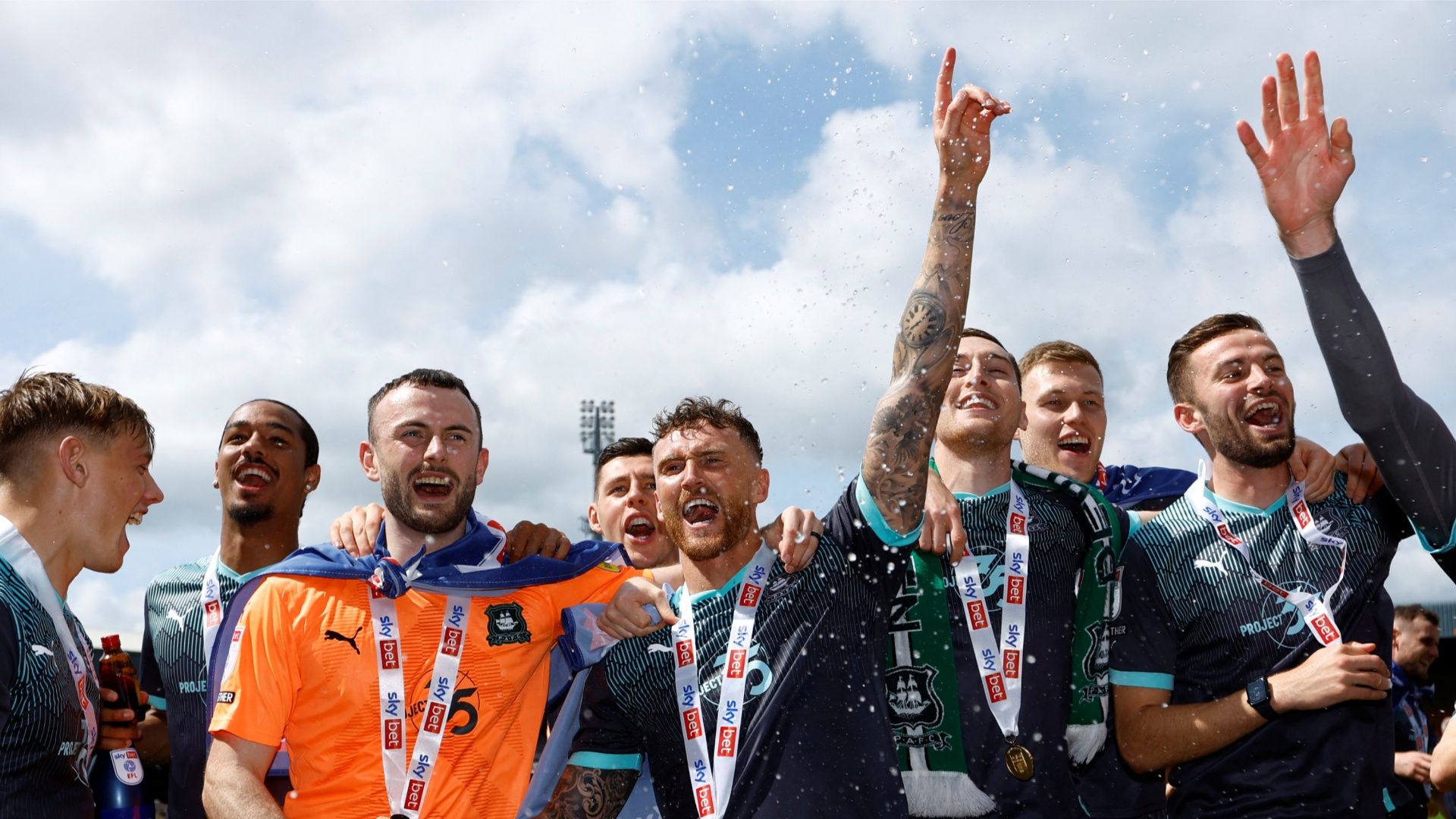 Plymouth Argyle goalkeeper Callum Burton celebrating the League One title win