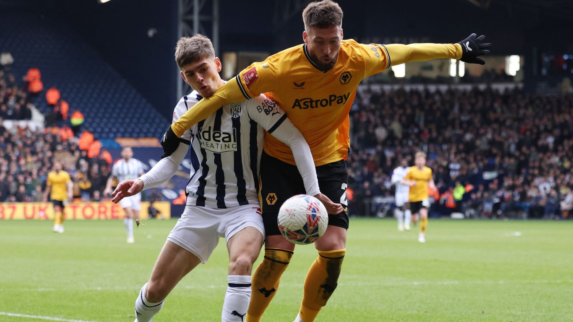 West Bromwich Albion's Tom Fellows in action with Wolverhampton Wanderers' Matt Doherty