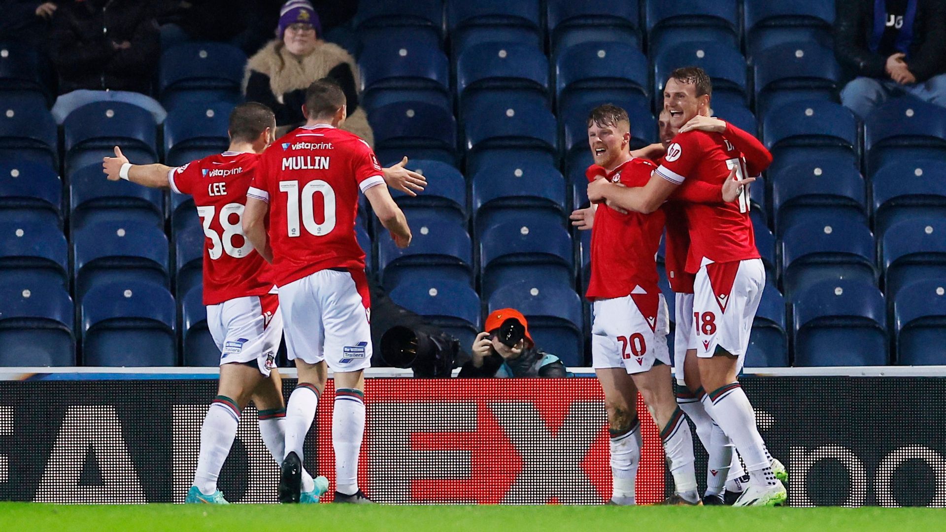 Andy Cannon celebrates with his Wrexham teammates 