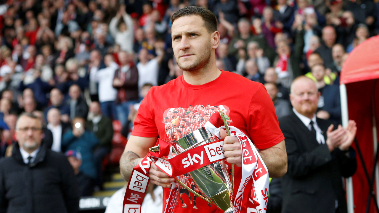 Billy Sharp holding the Championship trophy