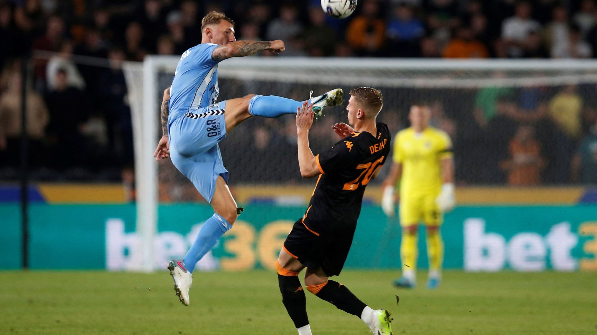 Liam Delap meets Kyle McFadzean in Hull City's 1-1 Coventry City draw