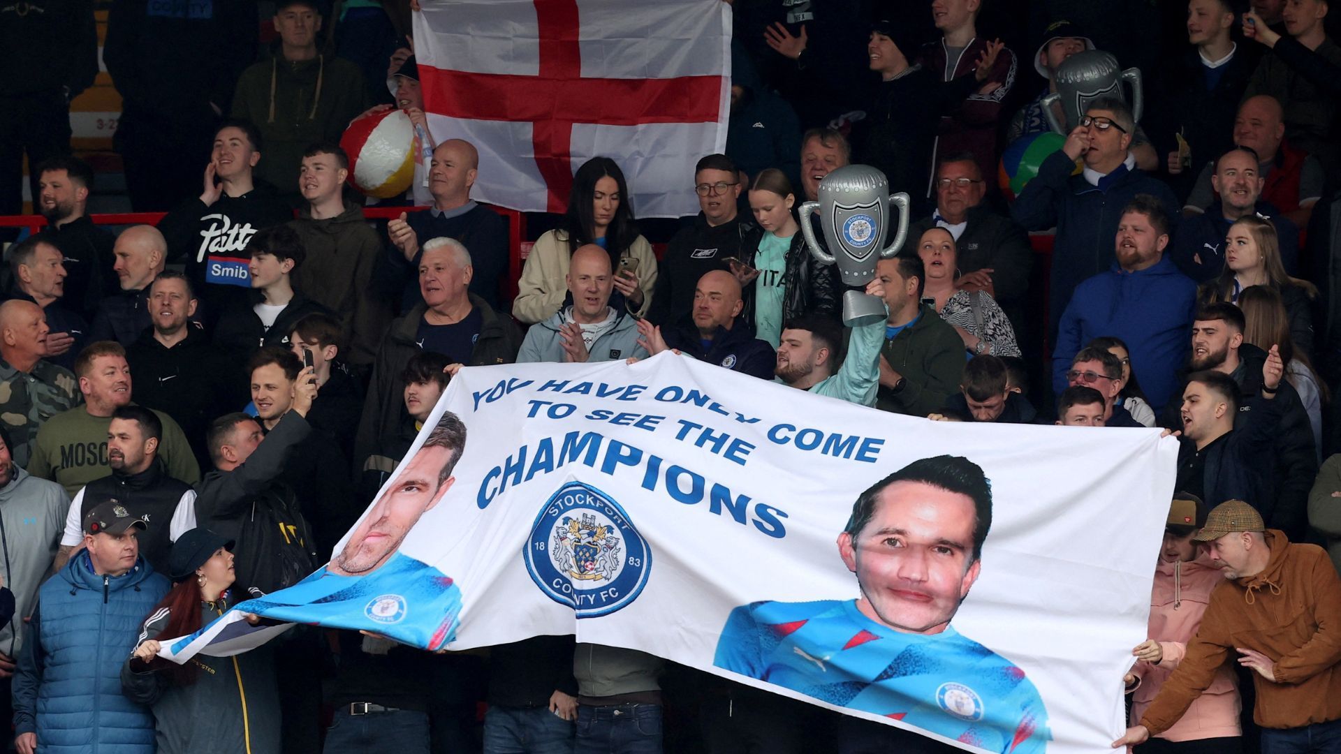 Stockport fans unveil a banner mocking Wrexham's owners
