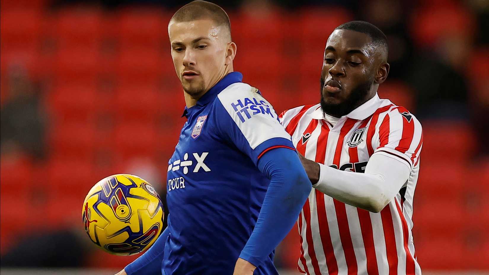 Soccer Football - Championship - Stoke City v Ipswich Town - bet365 Stadium, Stoke-on-Trent, Britain - January 1, 2024 Ipswich Town's Harry Clarke in action with Stoke City's Junior Tchamadeu