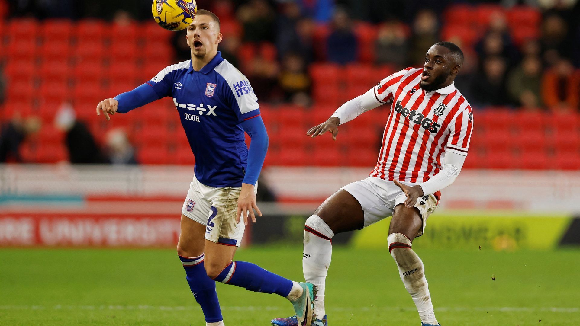 Soccer Football - Championship - Stoke City v Ipswich Town - bet365 Stadium, Stoke-on-Trent, Britain - January 1, 2024 Ipswich Town's Harry Clarke in action with Stoke City's Junior Tchamadeu