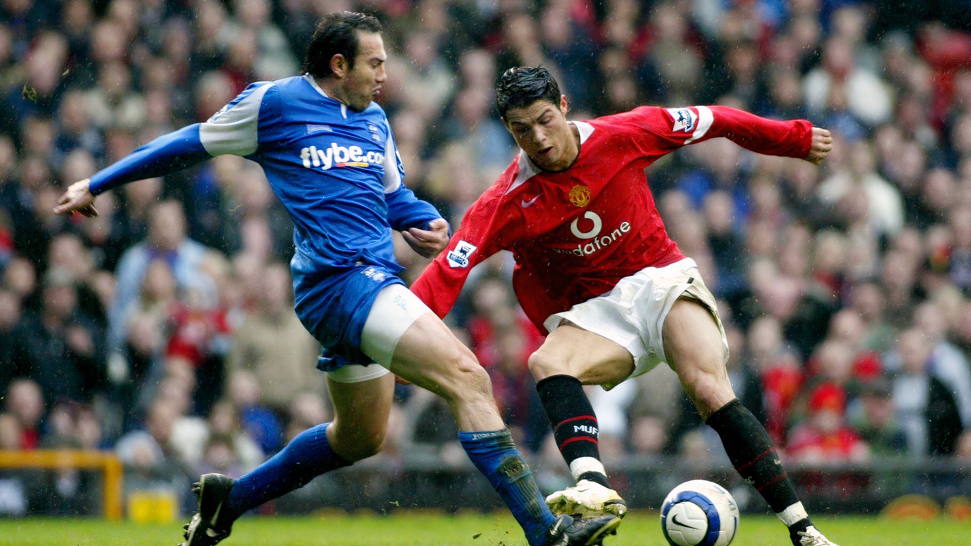 Stan Lazaridis battles with Manchester United's Cristiano Ronaldo in March 2006