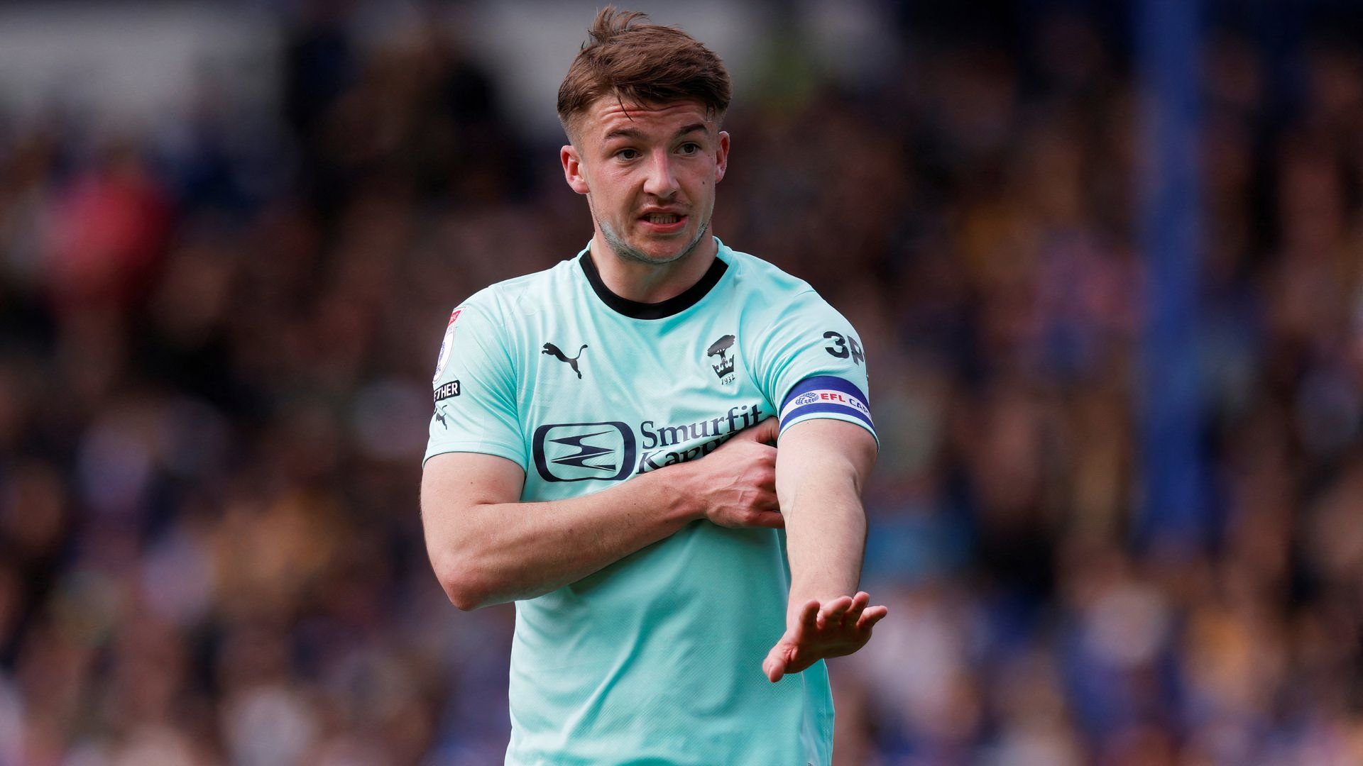 Charlie Hughes captaining Wigan Athletic