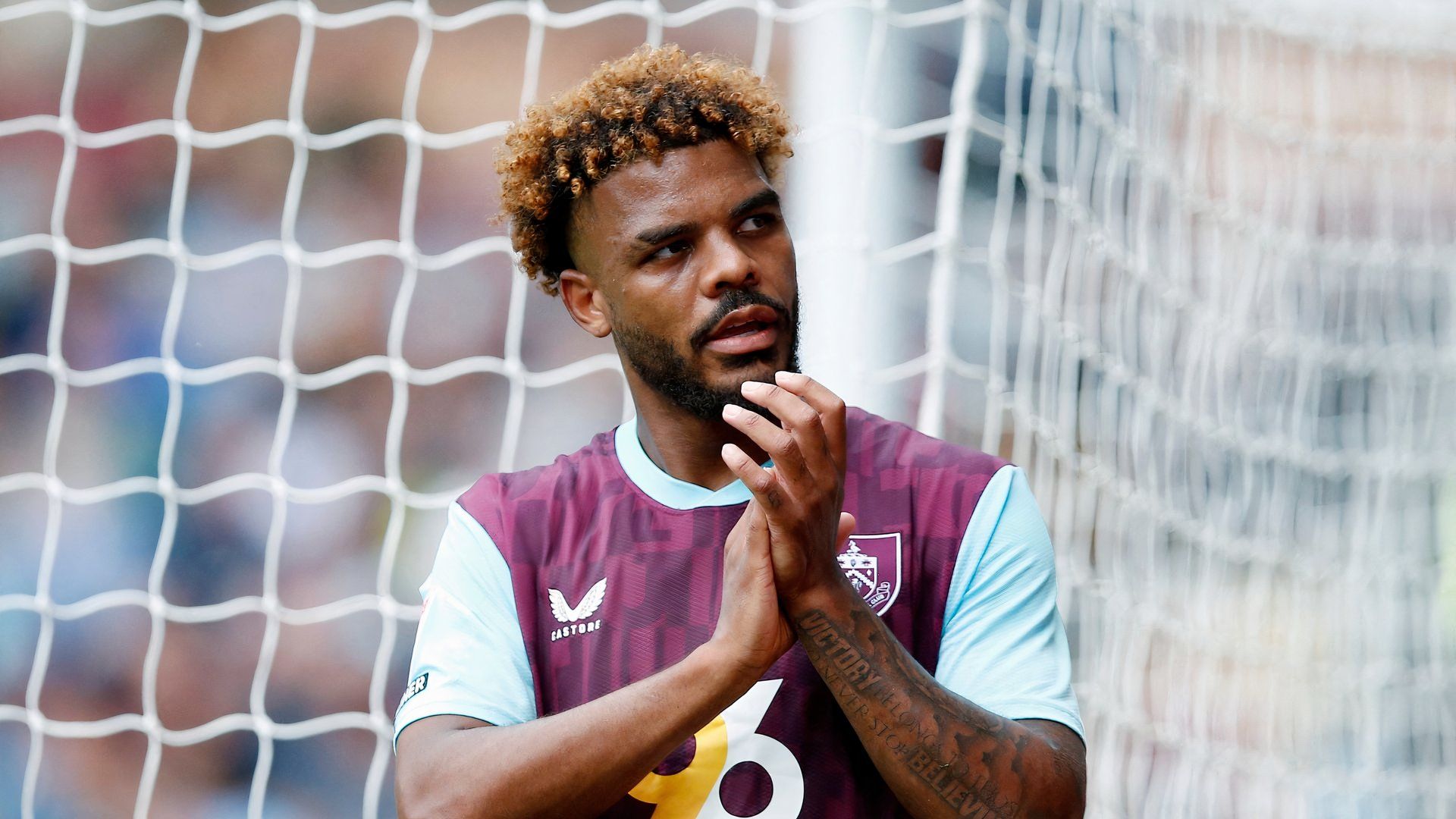 Lyle Foster applauds the Burnley fans vs Cardiff City