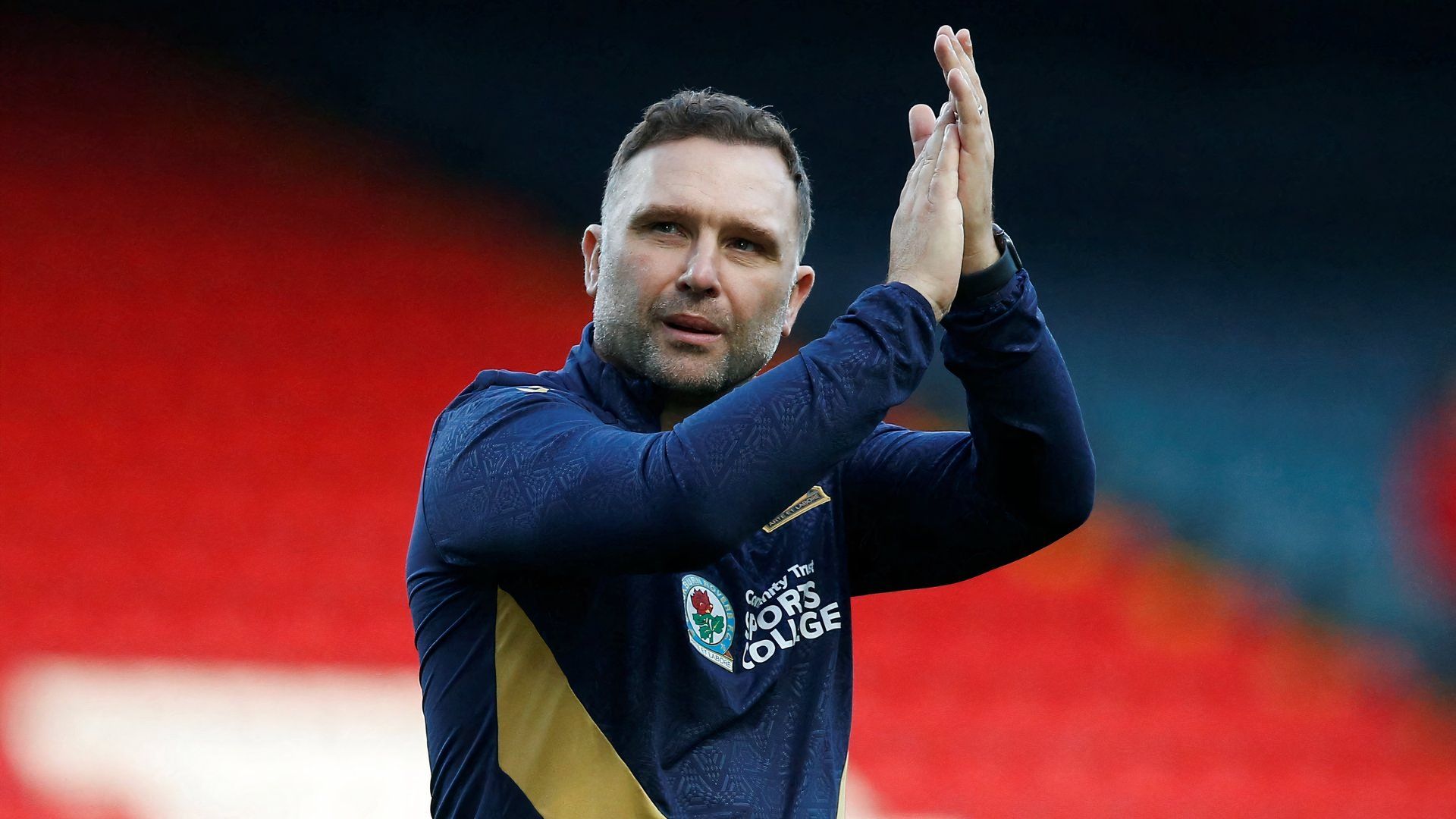 John Eustace applauds the Blackburn Rovers supporters at Ewood Park