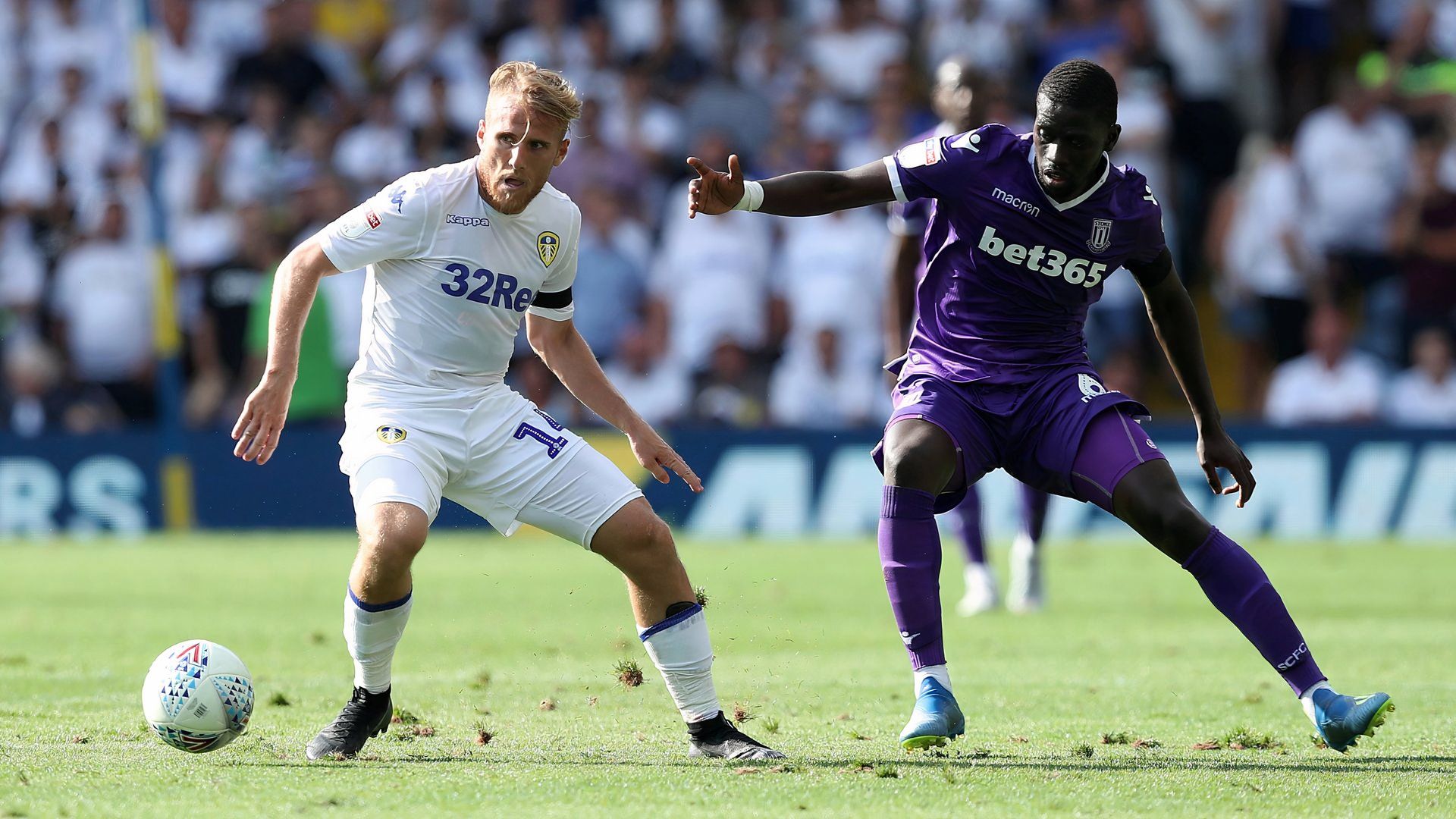 Stoke City's Badou Ndiaye and Leeds United's Samuel Saiz in action in the Championship at Elland Road