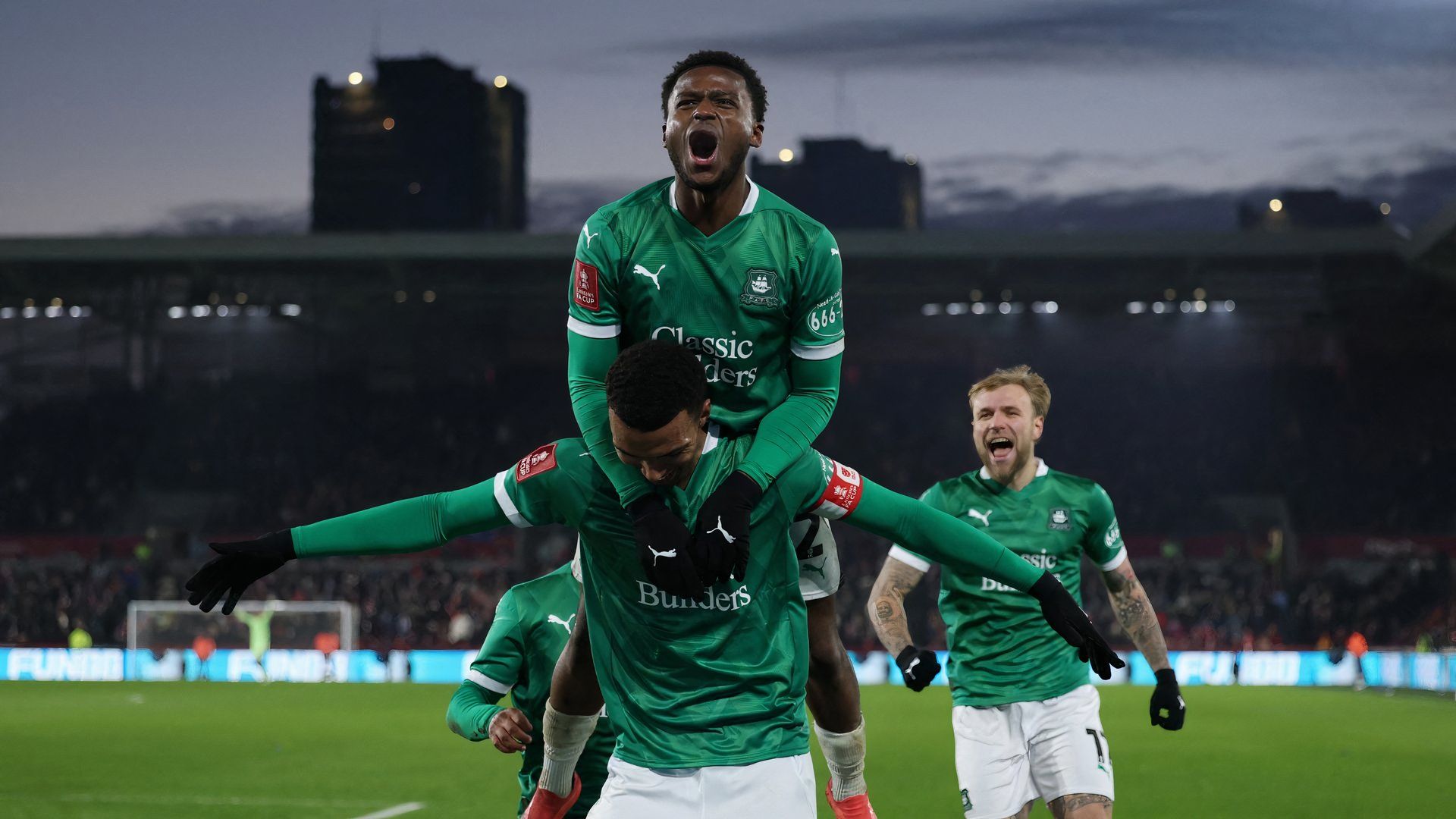 Bali Mumba celebrates with Morgan Whittaker