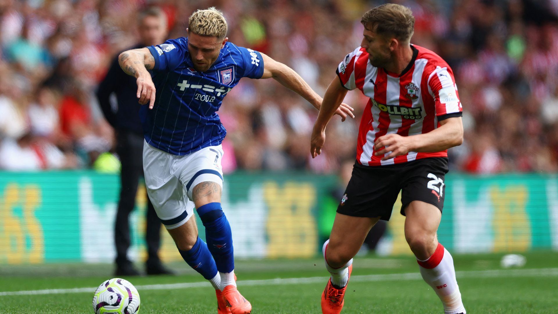 Southampton's Charlie Taylor battles with Ipswich Town's Wes Burns
