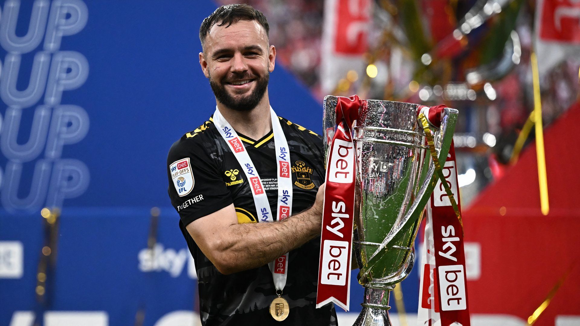 Southampton's Adam Armstrong celebrates with the trophy after winning the Championship Play-Off final