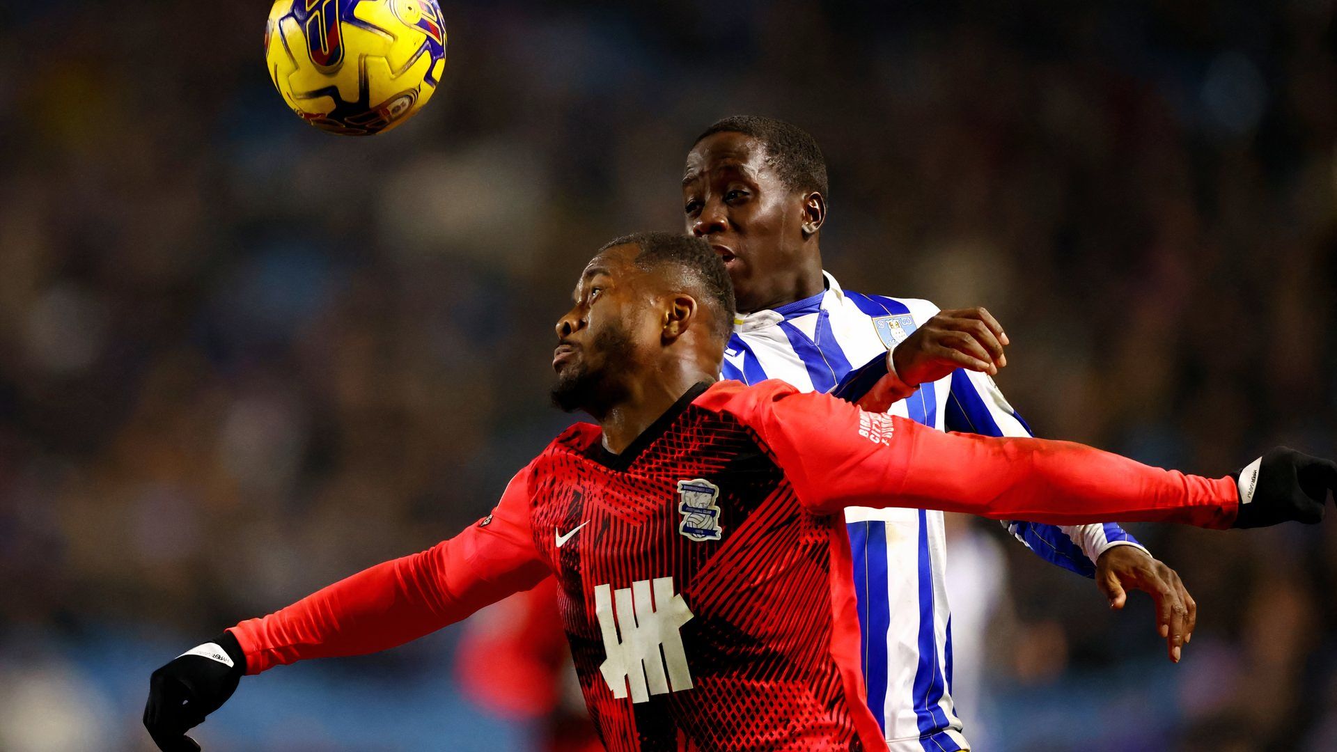 Birmingham City's Ethan Laird in action with Sheffield Wednesday's Djeidi Gassama