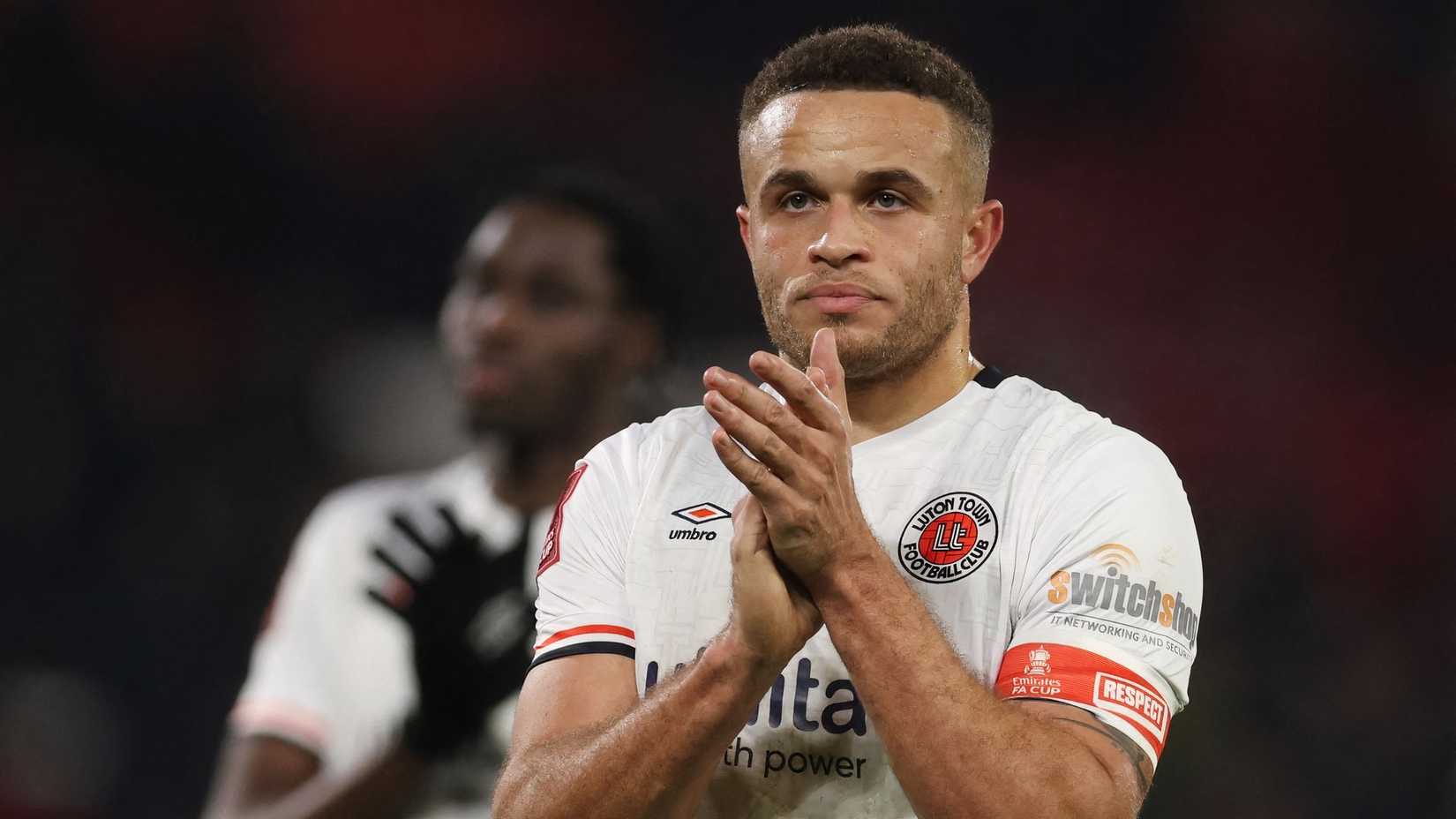 Carlton Morris applauds the Luton Town support