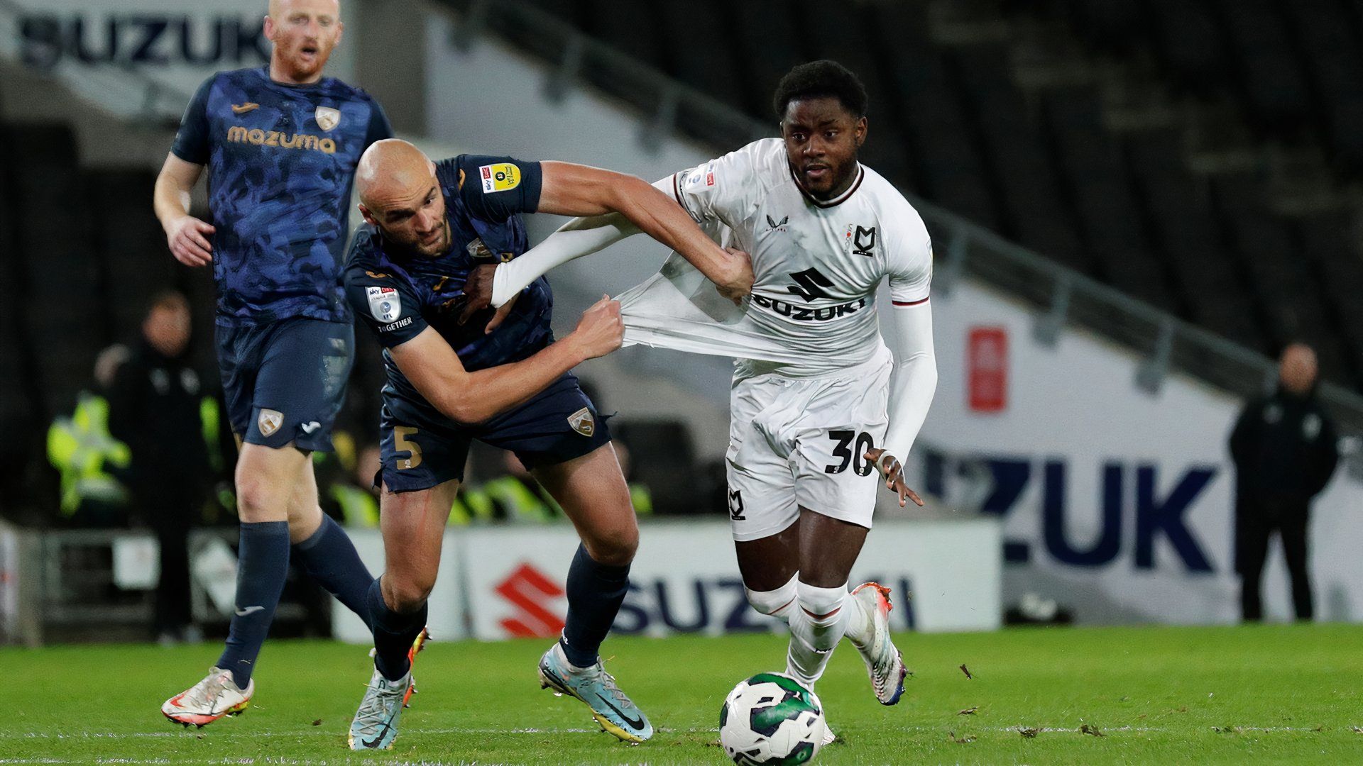 Milton Keynes Dons' Matthew Dennis in action before scoring their second goal