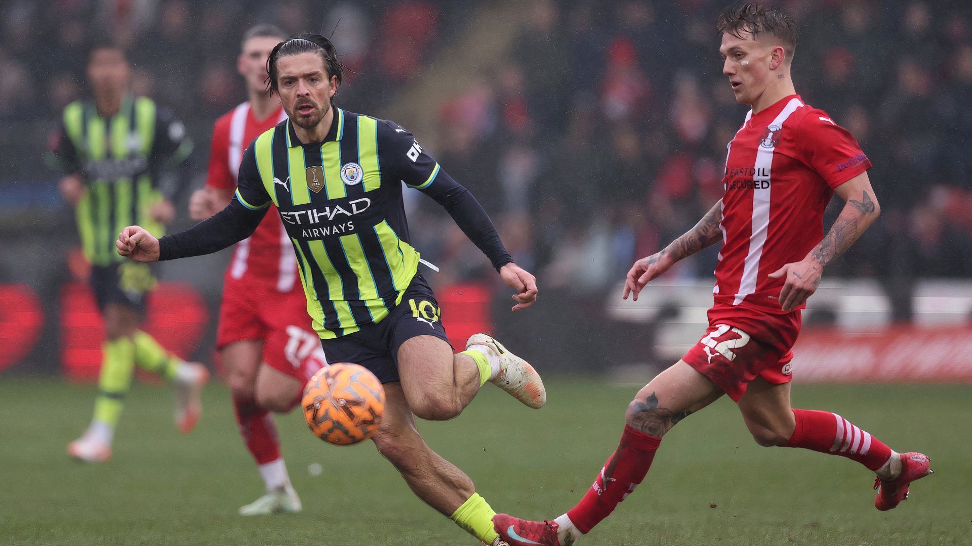Manchester Citys Jack Grealish in action with Leyton Orients Ethan Galbraith