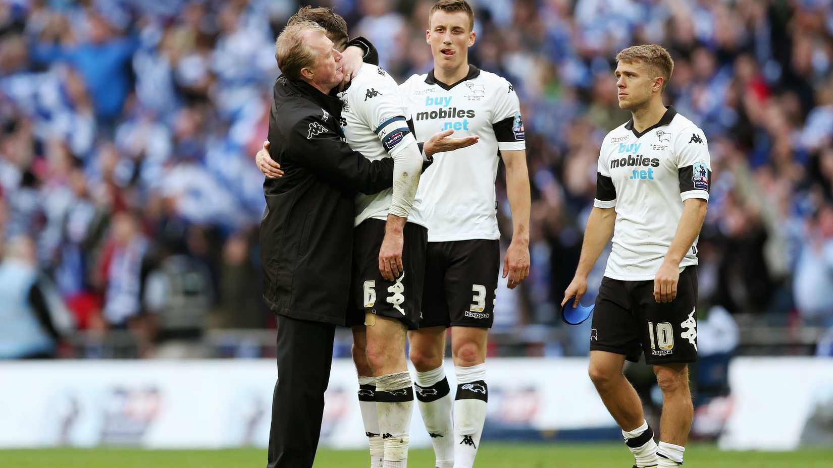 Steve McClaren hugging Richard Keogh, with Craig Forsyth and Jamie Ward in the background