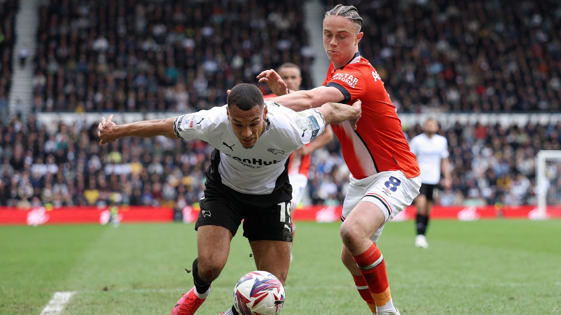 Derby County's Kayden Jackson in action with Luton Town's Thelo Aasgaard