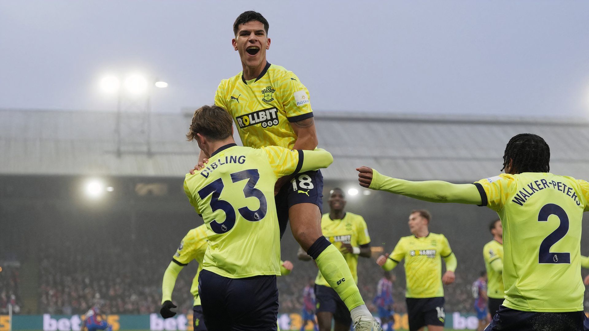 Southampton's Tyler Dibling celebrates scoring their first goal with Southampton's Kyle Walker-Peters and Southampton's Mateus Fernandes